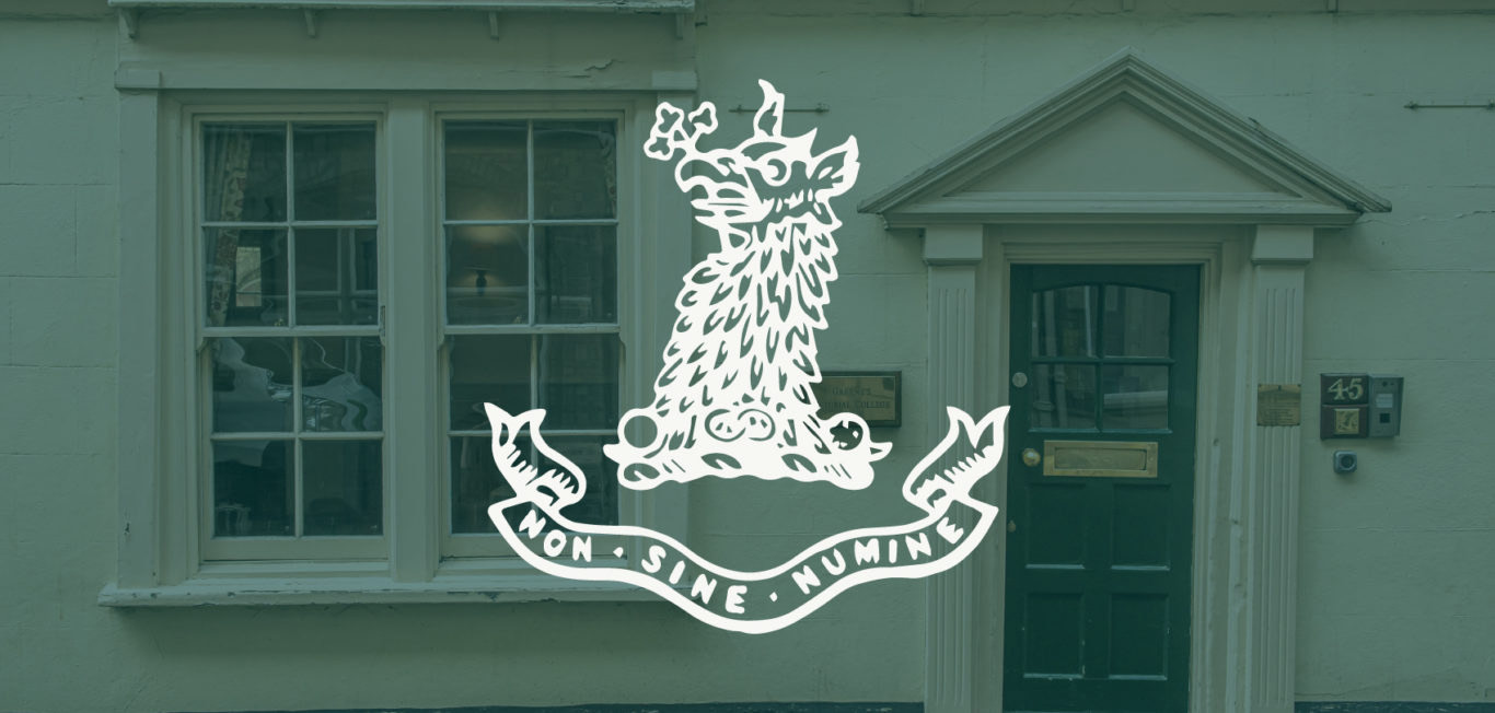 The green-painted facade of Greene's College Oxford at 45 Pembroke Street, showing the college crest and motto above the street door
